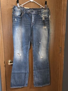 Silver Jeans Distressed Blue Flare Jeans